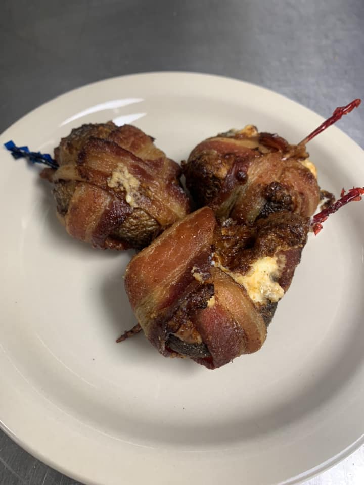 Bacon wrapped mushrooms filled with cheese from Ryder's Roadhouse in Wisconsin Rapids