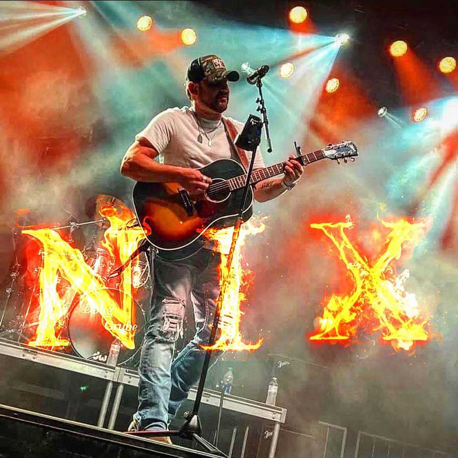 Ryders Roadhouse in Wisconsin Rapids Wisconsin Man playing guitar on stage with fiery letters NIX in front of him and colorful stage lights.
