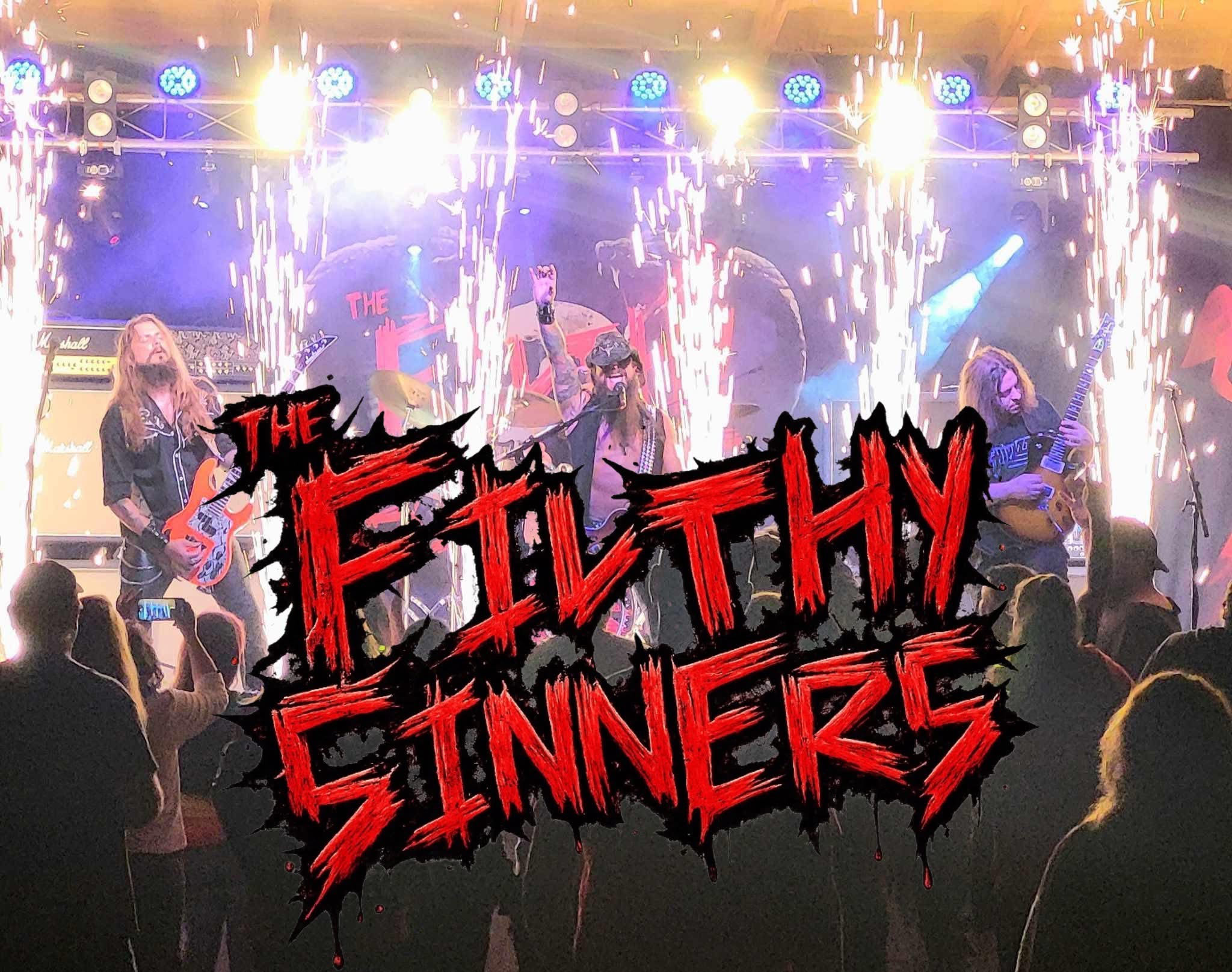 Ryders Roadhouse in Wisconsin Rapids Wisconsin Rock band performing on stage with pyrotechnics, bold text reads The Filthy Sinners.